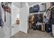 Tidy walk-in closet with closet organizers, and neutral carpet, for optimal storage at 1593 Osprey View Dr, Apopka, FL 32703