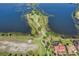 Overhead shot of a lakeside park with walking trails, a playground, a dock, and lush greenery, offering recreational opportunities at 17996 Adrift Rd, Winter Garden, FL 34787
