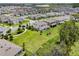 Aerial view of a home near a lush green space and pond at 17996 Adrift Rd, Winter Garden, FL 34787