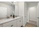 Bathroom featuring a double sink vanity with white cabinetry and granite countertop at 17996 Adrift Rd, Winter Garden, FL 34787