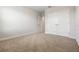 Neutral bedroom with carpet flooring, a double door closet and a white painted wall at 17996 Adrift Rd, Winter Garden, FL 34787