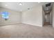 Spacious room featuring a large window and neutral carpet at 17996 Adrift Rd, Winter Garden, FL 34787