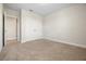 Carpeted bedroom with double door closet and access to additional rooms at 17996 Adrift Rd, Winter Garden, FL 34787