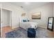 Comfortable bedroom with a plush rug, stylish accents, and ample natural light at 17996 Adrift Rd, Winter Garden, FL 34787