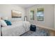 Cozy bedroom with natural light, soft rug, and tranquil view of the outdoors at 17996 Adrift Rd, Winter Garden, FL 34787