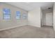 Bright bedroom with three windows at 17996 Adrift Rd, Winter Garden, FL 34787