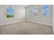 Bright bedroom with three large windows offering ample natural light at 17996 Adrift Rd, Winter Garden, FL 34787