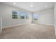 Large, light-filled bonus room with three windows and neutral carpet at 17996 Adrift Rd, Winter Garden, FL 34787