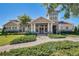 Attractive clubhouse exterior featuring stone accents and well-maintained landscaping at 17996 Adrift Rd, Winter Garden, FL 34787