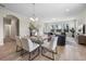 Open-concept dining and living areas with modern furnishings and scenic views at 17996 Adrift Rd, Winter Garden, FL 34787