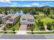 Beautiful two-story home with a well-manicured lawn and a scenic lake view at 17996 Adrift Rd, Winter Garden, FL 34787