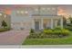 Inviting two-story home with a spacious front porch and three-car garage at 17996 Adrift Rd, Winter Garden, FL 34787