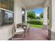 Inviting front porch with seating, offering a cozy outdoor living space at 17996 Adrift Rd, Winter Garden, FL 34787