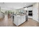 Modern kitchen features a large island, stainless steel appliances, and a breakfast bar at 17996 Adrift Rd, Winter Garden, FL 34787
