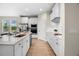 Bright kitchen with white cabinetry, stainless steel appliances, and stylish tile flooring at 17996 Adrift Rd, Winter Garden, FL 34787