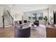 Comfortable living room with plush seating, natural light, and serene outdoor views at 17996 Adrift Rd, Winter Garden, FL 34787