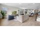 Open concept living space features tile flooring, modern furnishings, and views into the kitchen area at 17996 Adrift Rd, Winter Garden, FL 34787