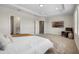 Carpeted main bedroom featuring recessed lighting, a TV, and an adjoining bathroom at 17996 Adrift Rd, Winter Garden, FL 34787