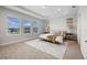 Comfortable main bedroom with ample natural light from large windows and a plush rug at 17996 Adrift Rd, Winter Garden, FL 34787