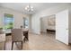Spacious home office featuring wood-look tile flooring and plenty of natural light at 17996 Adrift Rd, Winter Garden, FL 34787