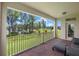 Covered patio with red brick flooring offers a peaceful view at 17996 Adrift Rd, Winter Garden, FL 34787
