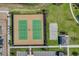 Aerial shot showcasing well-maintained tennis and sand volleyball courts, ideal for active residents and recreational fun at 17996 Adrift Rd, Winter Garden, FL 34787