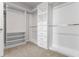 Walk-in closet with multiple tiers of shelving and drawers for optimal storage at 17996 Adrift Rd, Winter Garden, FL 34787