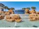 Stunning community water feature with cascading waterfalls and rock formations, creating a welcoming entrance at 17996 Adrift Rd, Winter Garden, FL 34787