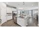 Beautiful kitchen features a center island with a double sink, sleek stainless steel appliances, and natural light at 2345 Volunteer Ave, Kissimmee, FL 34744