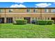 The backyard features a well-manicured lawn and privacy hedges for outdoor enjoyment, and patio at 2508 Seven Oaks Dr, St Cloud, FL 34772