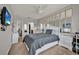 Spacious bedroom featuring mirrors, a ceiling fan and ample natural light at 2508 Seven Oaks Dr, St Cloud, FL 34772