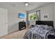 Comfortable bedroom featuring ceiling fan and a wall mounted TV at 2508 Seven Oaks Dr, St Cloud, FL 34772