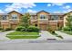 Attractive townhomes feature attached garages, neutral exteriors, landscaping and individual driveways at 2508 Seven Oaks Dr, St Cloud, FL 34772