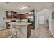 Lovely kitchen features a central island with barstool seating, stainless appliances, and modern cabinetry at 2508 Seven Oaks Dr, St Cloud, FL 34772