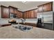 Gourmet kitchen with stainless steel appliances, ample cabinet space, and a functional island at 2508 Seven Oaks Dr, St Cloud, FL 34772