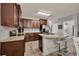 Modern kitchen with granite counters, stainless steel appliances, and a central island with seating at 2508 Seven Oaks Dr, St Cloud, FL 34772