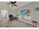 Living room with tile floors, light gray walls, ceiling fan, TV, and comfortable furnishings at 2508 Seven Oaks Dr, St Cloud, FL 34772