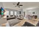 Living room and dining area showcasing neutral decor, tile floors, and abundant natural light at 2508 Seven Oaks Dr, St Cloud, FL 34772