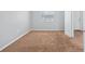 Spacious bedroom with neutral carpet, a window with blinds, and a doorway at 2517 Caper Ln # 207, Maitland, FL 32751