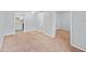 Neutral living room showcasing an open layout with access to kitchen and bedroom at 2517 Caper Ln # 207, Maitland, FL 32751