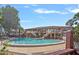 Community pool with clear water and multi-story buildings in the background at 2517 Caper Ln # 207, Maitland, FL 32751