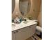 Bathroom featuring dual sinks, white cabinetry, and neutral wall paint at 2536 Lancien Ct # 5, Orlando, FL 32826