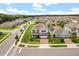 Aerial view of a home with a manicured lawn in a suburban neighborhood at 2541 Leyland Cypress Ln, Sanford, FL 32773