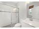 Bathroom featuring a glass enclosed shower with grey tile flooring and quartz countertop vanity at 2541 Leyland Cypress Ln, Sanford, FL 32773