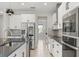 Kitchen showcasing modern appliances, sleek cabinetry, and tile flooring for a clean and efficient space at 2541 Leyland Cypress Ln, Sanford, FL 32773