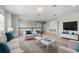 Spacious living room with modern furniture, ample seating, and neutral decor at 2541 Leyland Cypress Ln, Sanford, FL 32773