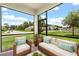 Relaxing screened patio overlooking the landscaped backyard and neighborhood at 2541 Leyland Cypress Ln, Sanford, FL 32773