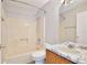 Bathroom featuring a tub-shower combination, a toilet, and a vanity with a marble-look countertop at 2742 Woodruff Dr, Orlando, FL 32837