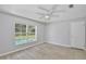 Light-filled bedroom view with wood-look floors and pool view at 2742 Woodruff Dr, Orlando, FL 32837