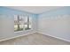 Bedroom featuring wood-look floors, light-blue accents, and a window with blinds at 2742 Woodruff Dr, Orlando, FL 32837